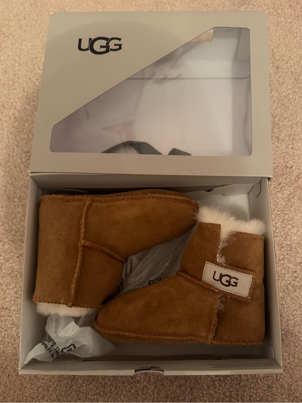 UGG Chestnut Booties baby size 6-7 (18-24 months) brand new. Soft botton